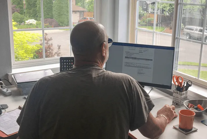Probation officer in the Western District of Washington reviews the court’s judgment on a case while working remotely from his home